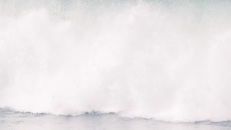 large waves crashing forcefully in the pacific ocean surf