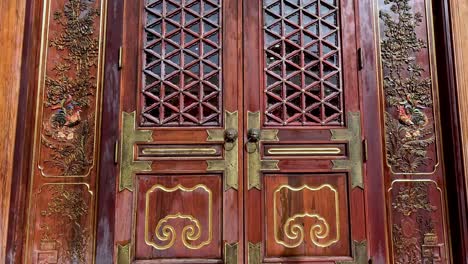 intricately designed wooden door with decorative carvings