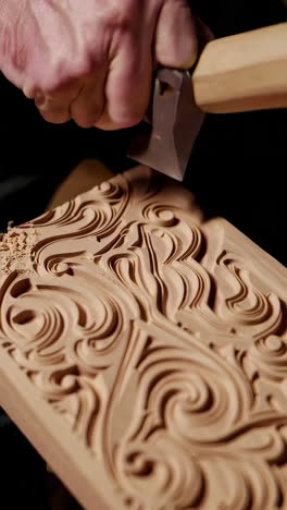 closeup of wood carving in progress