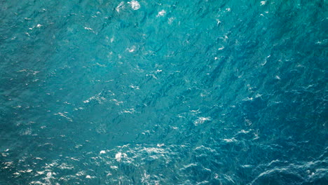 blue ocean - top down view of blue ocean with calm waves