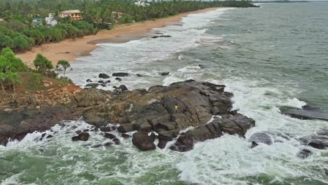 sea waves crashing on rock slow motion, fisherman fishing