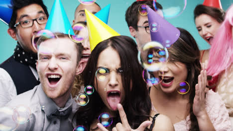 multi racial group of happy people dancing with bubbles slow motion party photo booth