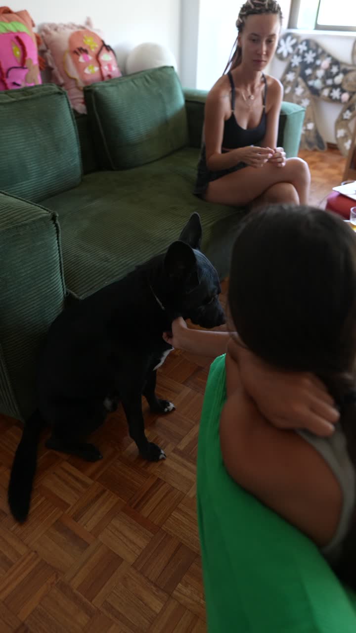 Living Room Scene with People and a Dog