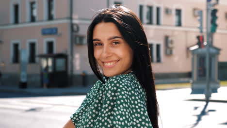 woman smiling in the city street