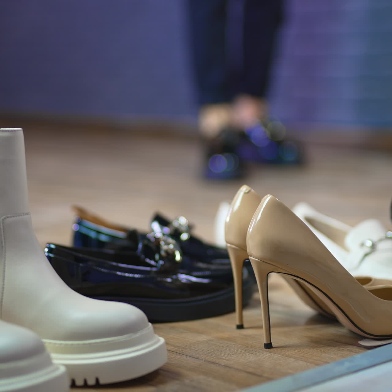 Close up view of shoes on the floor. Slow motion lifestyle stylish footwear