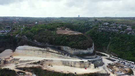 Lambok,-Bali,-Indonesia,-aerial-panorama-over-the-stone-quarry-on-the-coastline-of-the-island