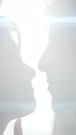 couple kissing in sunlight