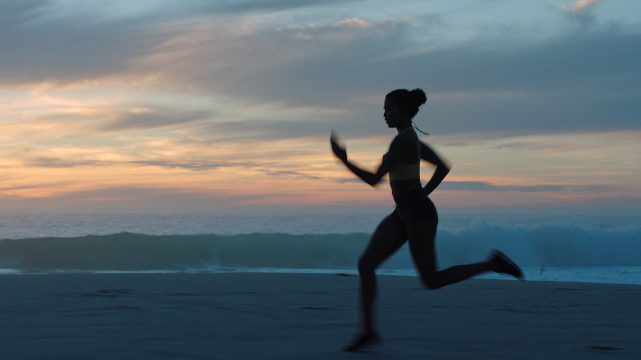 Woman Running on the Beach at Sunset