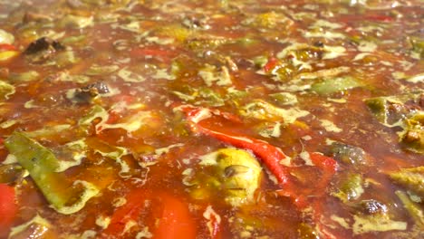 valencian paella boiling before throwing the rice