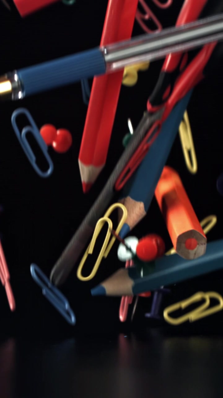 Colorful Office and School Supplies Falling in Slow Motion
