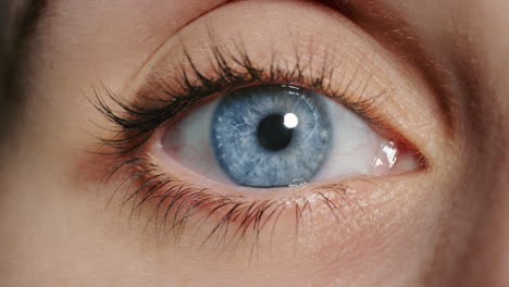 close up beautiful blue eye opening human iris macro natural beauty