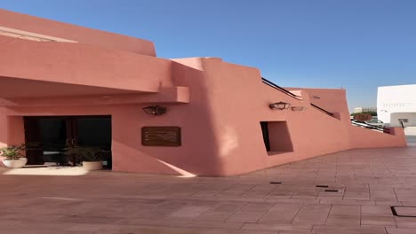 pink and white modern architecture in sunny courtyard