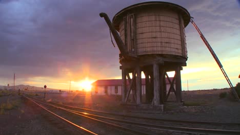 a water towers along an abandoned railroad track at dusk 2