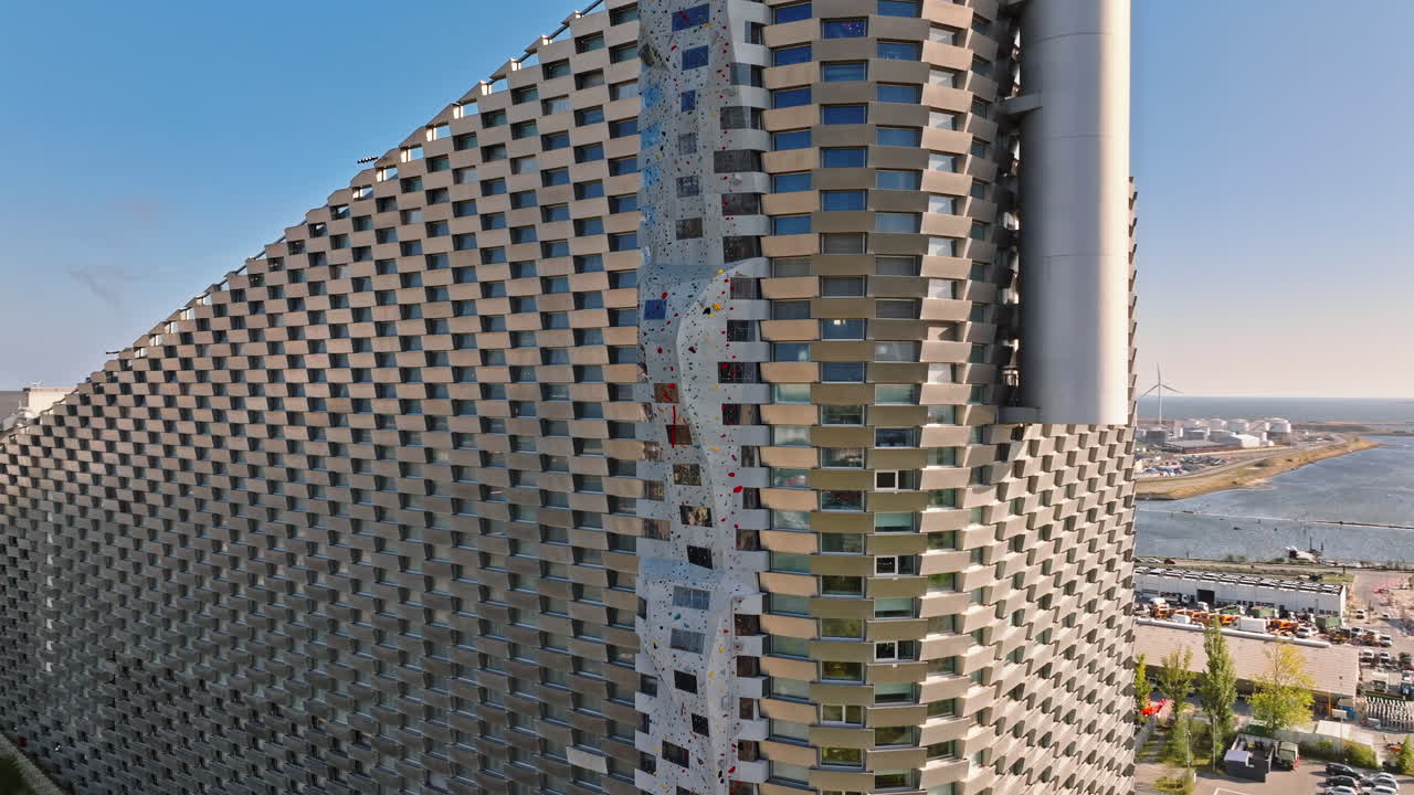 Aerial drone view of CopenHill artificial ski slope on the roof of an energy plant