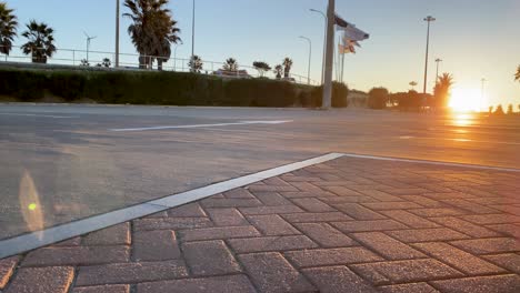 Excited-man-carving-asphalt-road-at-beach-park-on-summer-day