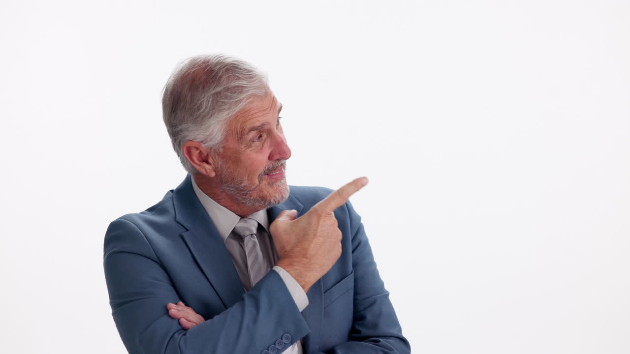 Mature businessman pointing to the side