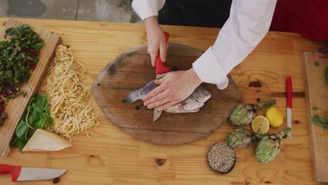 chef cutting a fish