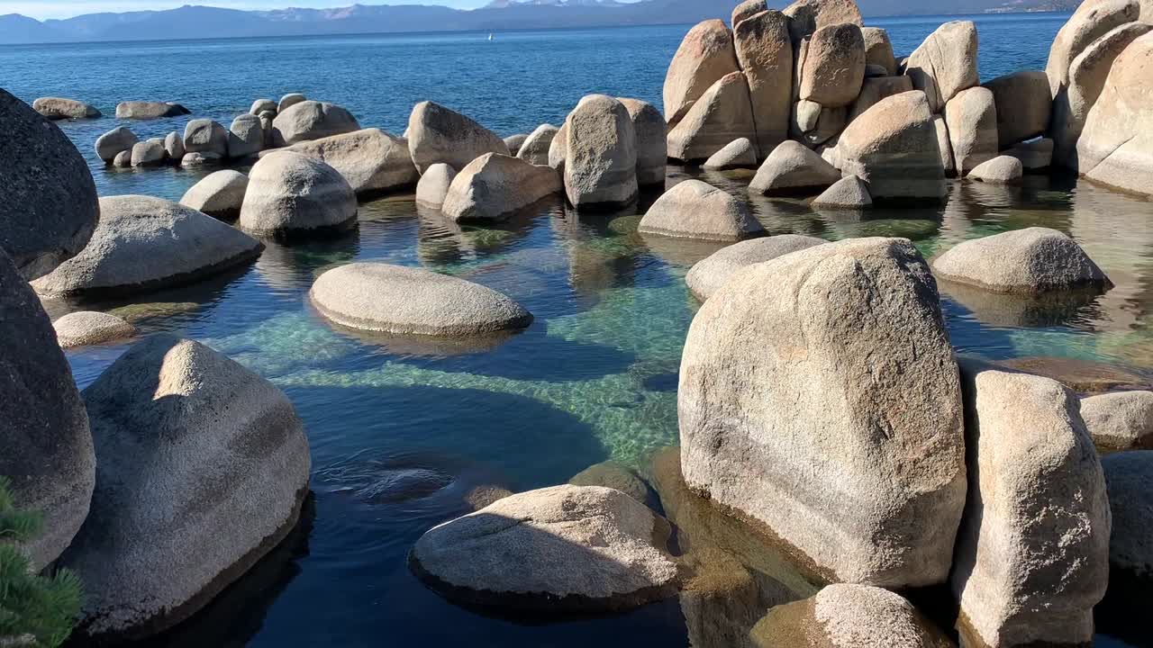 White rocks and crystal clear blue water at Sand Harbor Beach State Park in Lake Tahoe, Nevada.