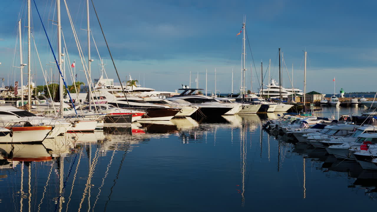 Antibes, France - May 23, 2025: Multiple white boats docked in the Port Vauban on a cloudy day