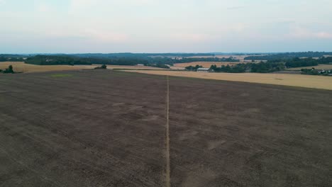 a reveal shot of kent countryside in kent following a narrow footpath