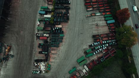 garbage trucks standing parked at parking lot helping waste management