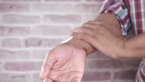 applying cream to wrist