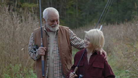 grandfather and grandson bond while fishing outdoors