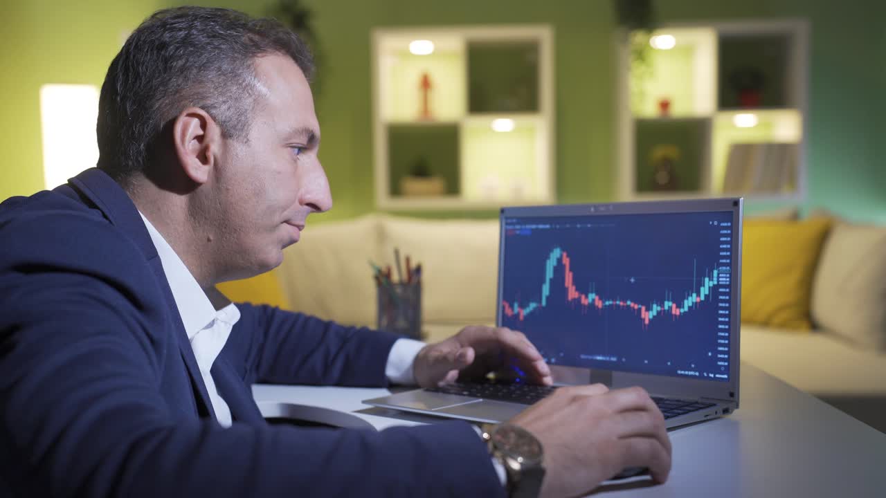 Online stock broker looking thoughtfully at the charts.