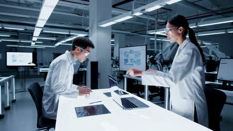 scientists collaborate in a modern robotics lab
