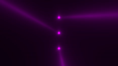 purple glowing spotlight beams on black gradient stage