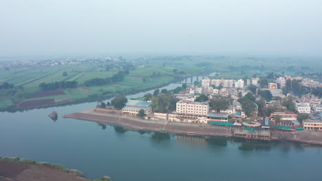 scenic confluence of krishna and panchaganga rivers, with merging waters flowing through picturesque landscapes and rich greenery
