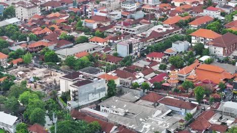 kuta bali cityscape, aerial of indonesian city with traditional building rooftops. urban landscape.