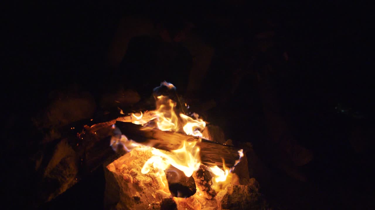 beauitufl shot of a campfire in slowmotion during night time