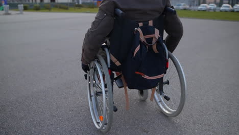 person in wheelchair outdoors