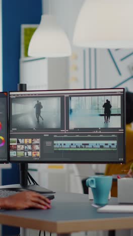 vertical video black videographer putting on headset editing movie