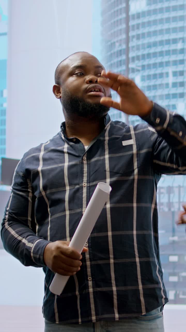 African American Businessman Explaining Project with Gestures in Office