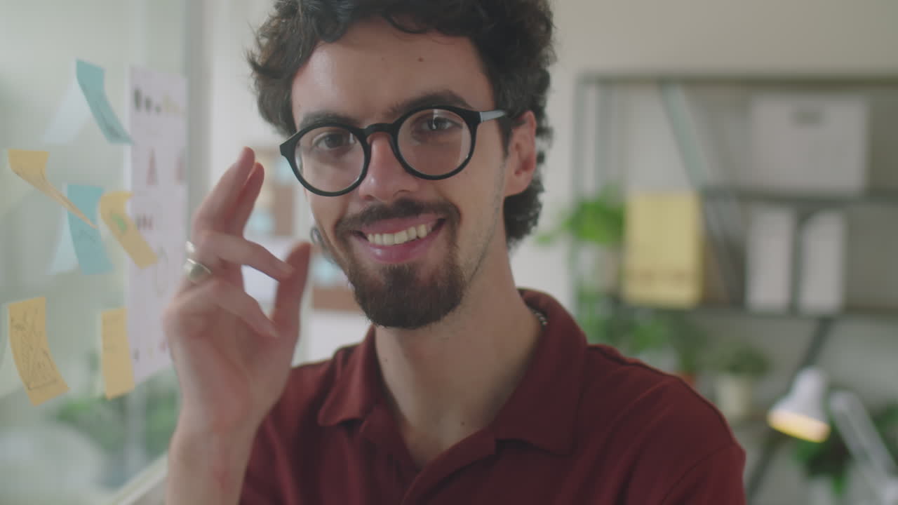Portrait of Happy Young Businessman in Office