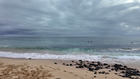 shipwreck beach on kauai, hawaii known for surfing and sunset viewing popular spot for cliff jumping, at sunset. beach at grand hyatt kauai resort spa