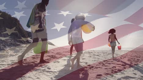 animation of flag of united states of america over african american family on beach