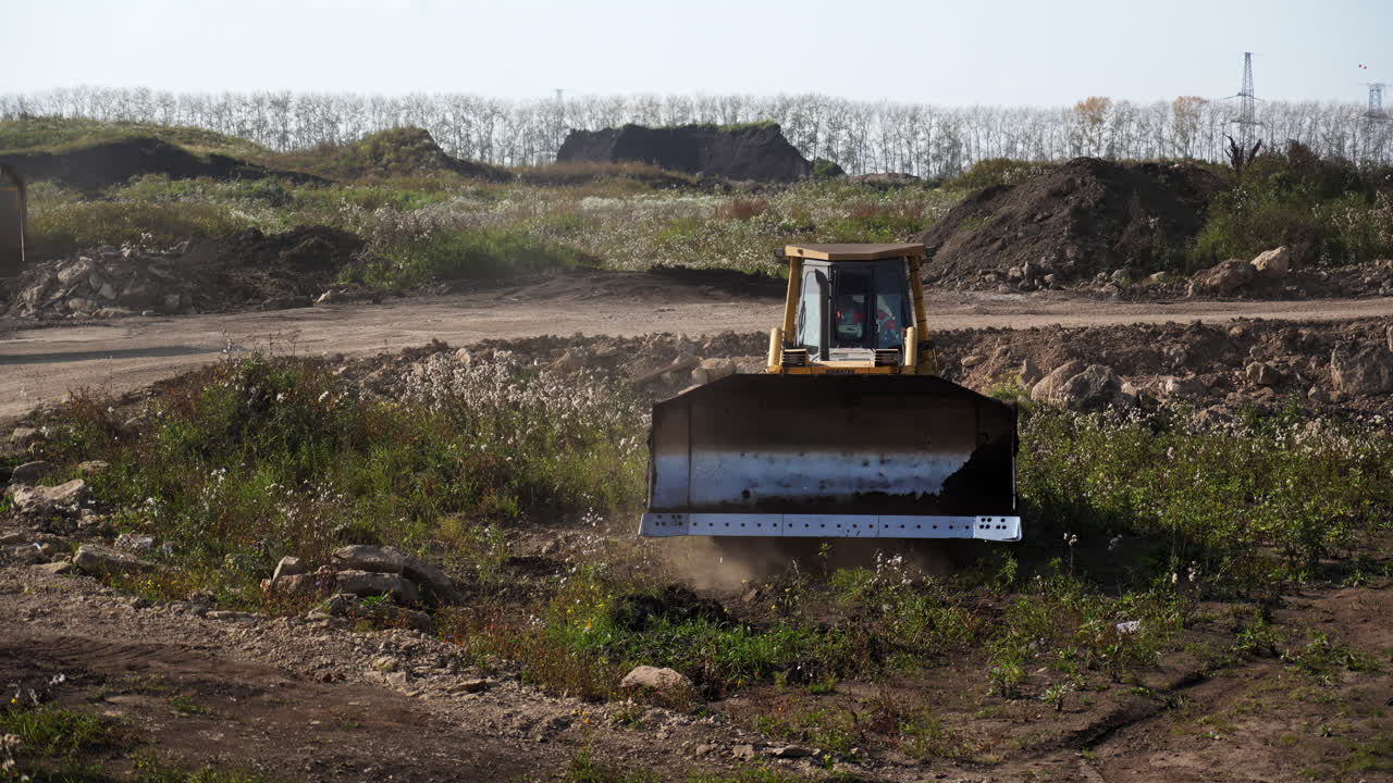 A bulldozer and dump truck at a construction site