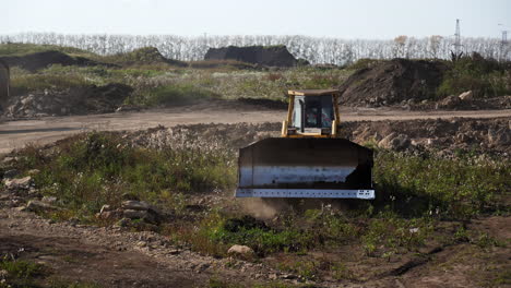 a bulldozer and dump truck at a construction site