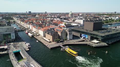 nyhavn harbor pan with taxi bus, copenhagen, denmark