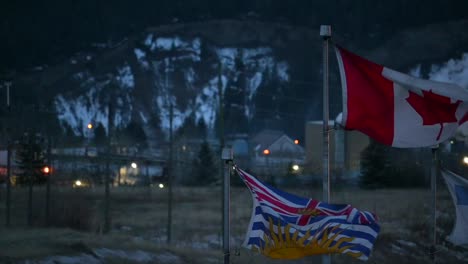 A-Canadian-and-British-Columbia-flag-is-waving-in-the-wind-in-a-northern-community