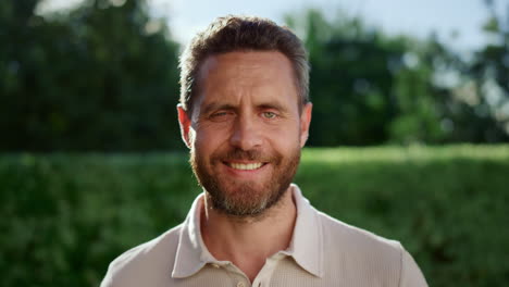 Handsome-man-looking-at-camera.-Closeup-positive-guy-smiling-at-camera