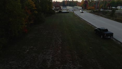 Drone-descending-near-a-factory-entry-road-in-Muskegon