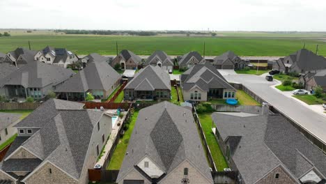 rising aerial of new single family homes in suburban residential development in southern usa