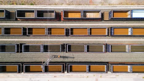 top-down shot revealing the empty freight wagons halting the laos economy