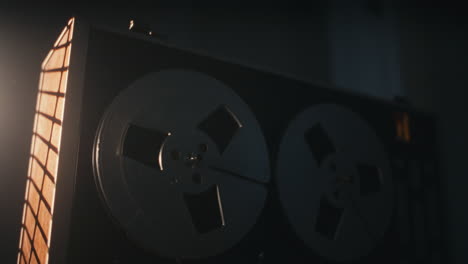 a vintage tape recorder in a red blinking light