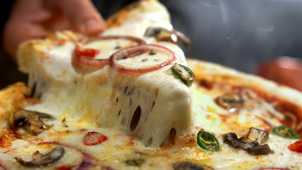 Delicious pizza with melting cheese