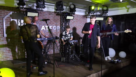 live concert of a ukrainian music band latexfauna in kyiv ukraine, singers singing, dancing and having fun on a stage, entertainers performing, 4k shot